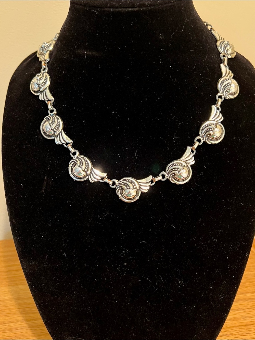 Chunky silver toned necklace.